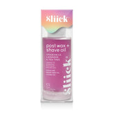 A bottle of Sliick Post Wax + Shave Oil with pink and purple labeling, indicating it contains chamomile, lavender, and tea tree oils, and is 4oz in size.