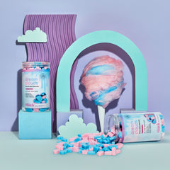 Two Dream Clouds Hard Wax Beads containers with packaging labeled 'dream clouds' on a colorful stylized background