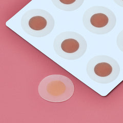 Sliick Ingrown Patches on white card with a pink background