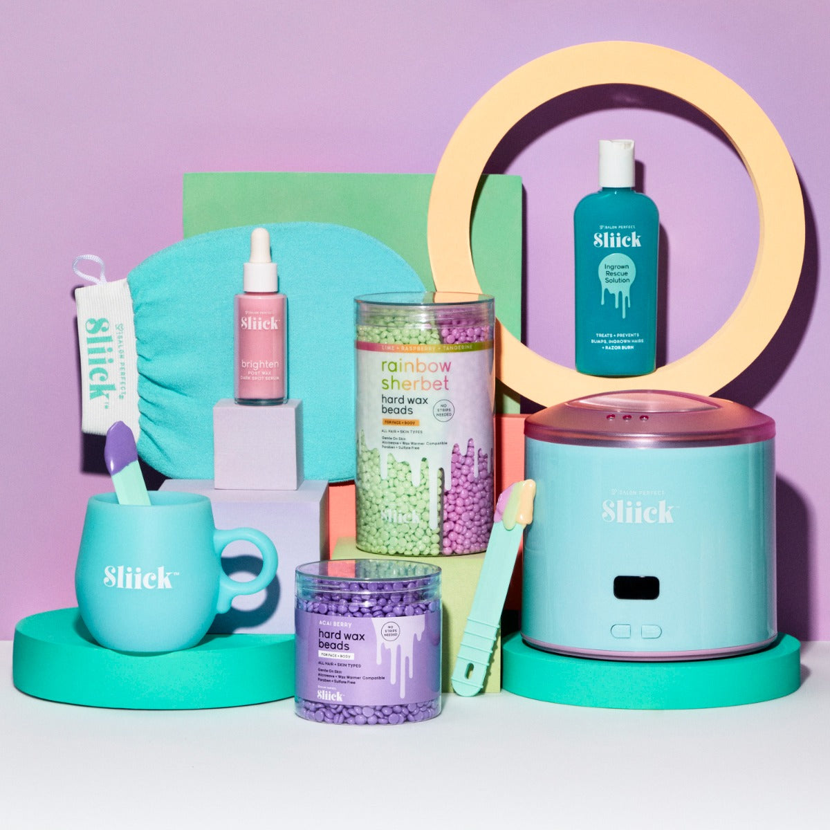 Sliick Beauty & Waxing – Wax warmer, silicone cup, spatulas, exfoliating mitt, serums, ingrown solution & scented wax beads on a pastel backdrop.